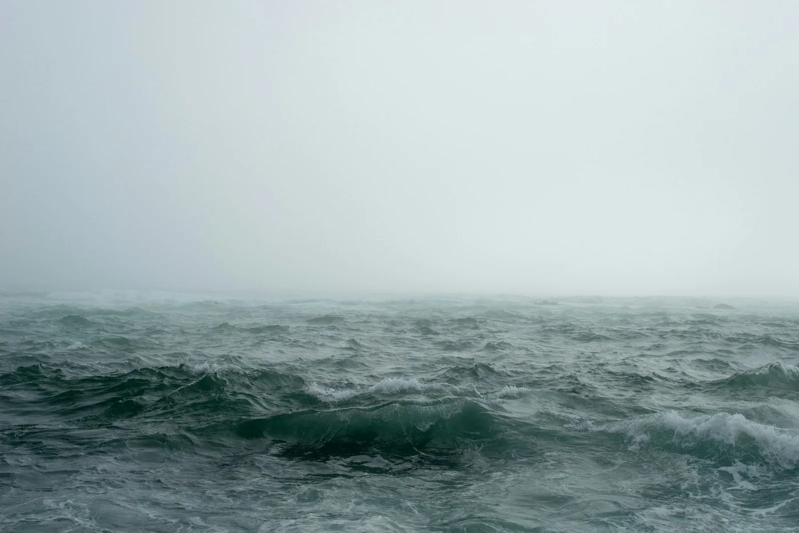 A dark stormy sea under heavy clouds